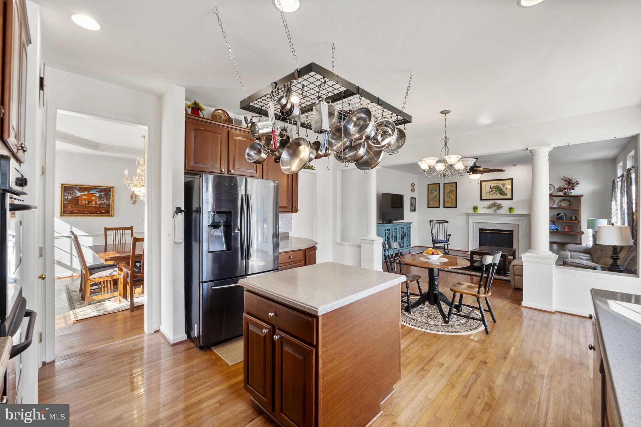 6528 Atkins Way Gainesville, VA 20155 - Photo 13 of 50 a view of a dining room with furniture wooden floor and a chandelier