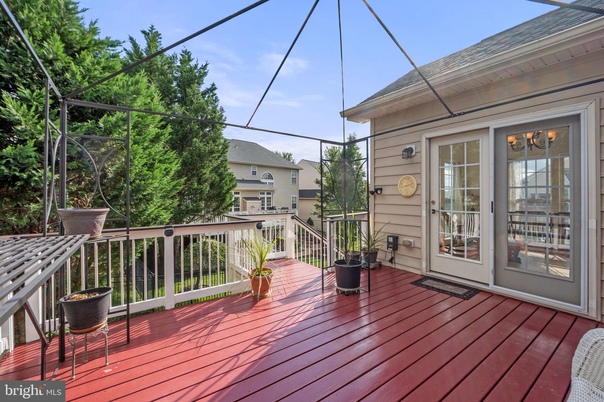 6528 Atkins Way Gainesville, VA 20155 - Photo 19 of 50 a view of a balcony with wooden floor