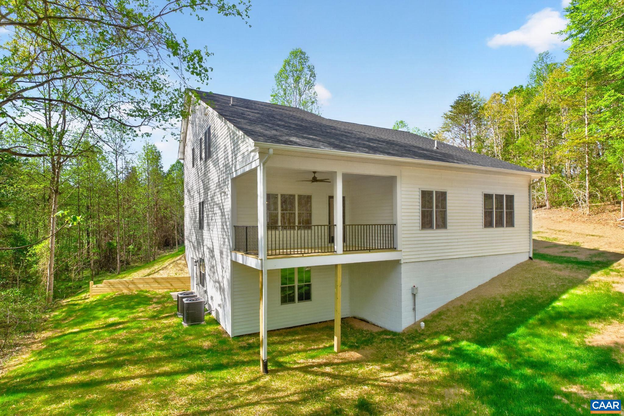 236 Palmer Place Ruckersville, VA 22968 - Photo 2 of 65 a view of a house with a yard
