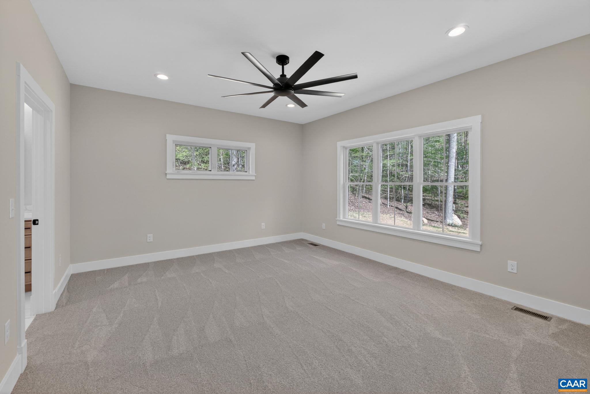236 Palmer Place Ruckersville, VA 22968 - Photo 28 of 65 an empty room with a window and a ceiling fan