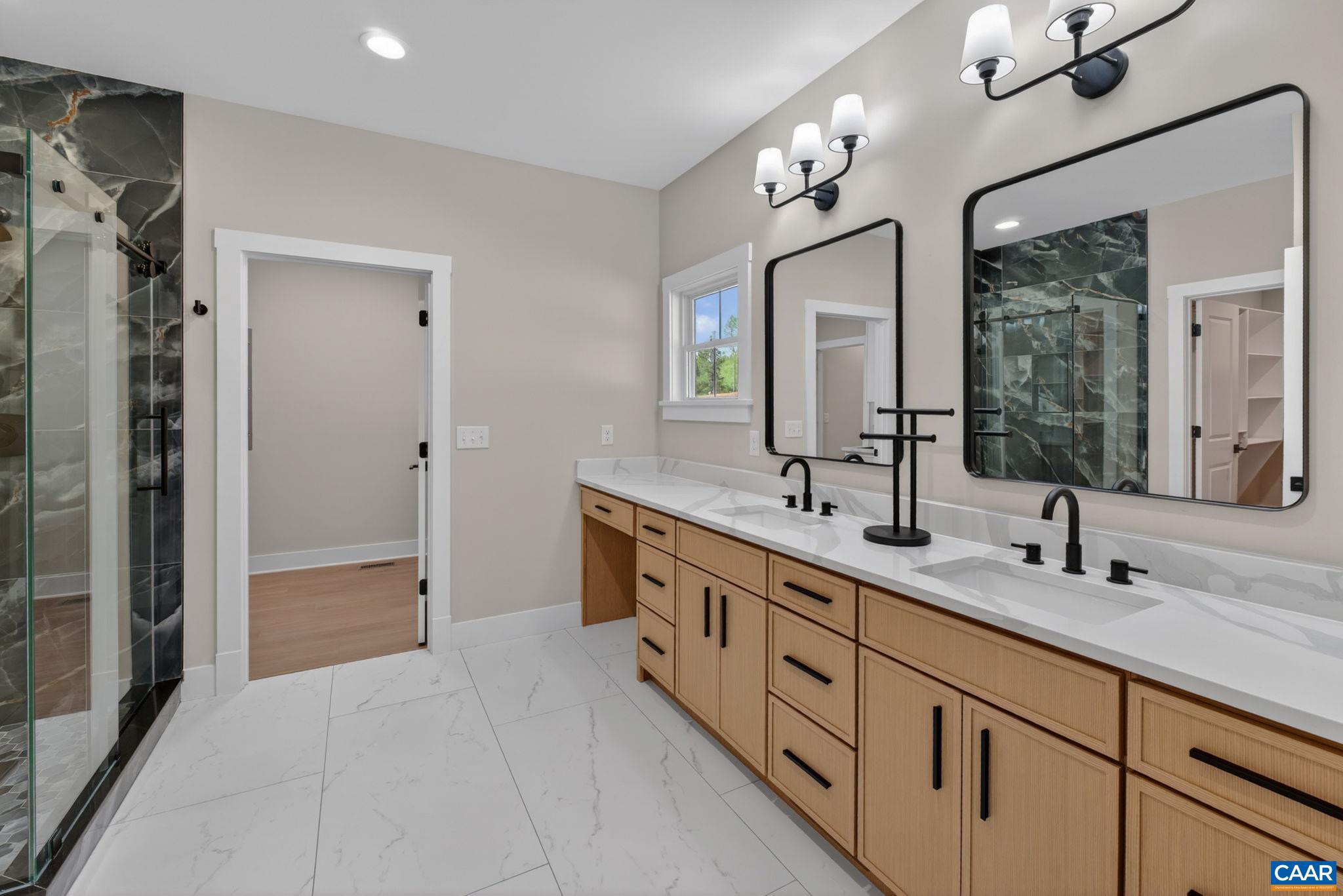 236 Palmer Place Ruckersville, VA 22968 - Photo 31 of 65 a spacious en suite bathroom with double sink and a large mirror