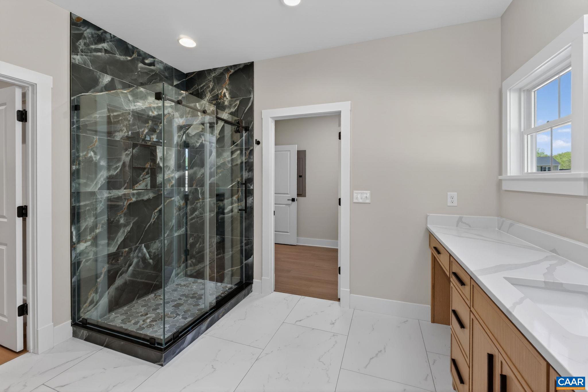 236 Palmer Place Ruckersville, VA 22968 - Photo 33 of 65 a bathroom with a shower and a sink