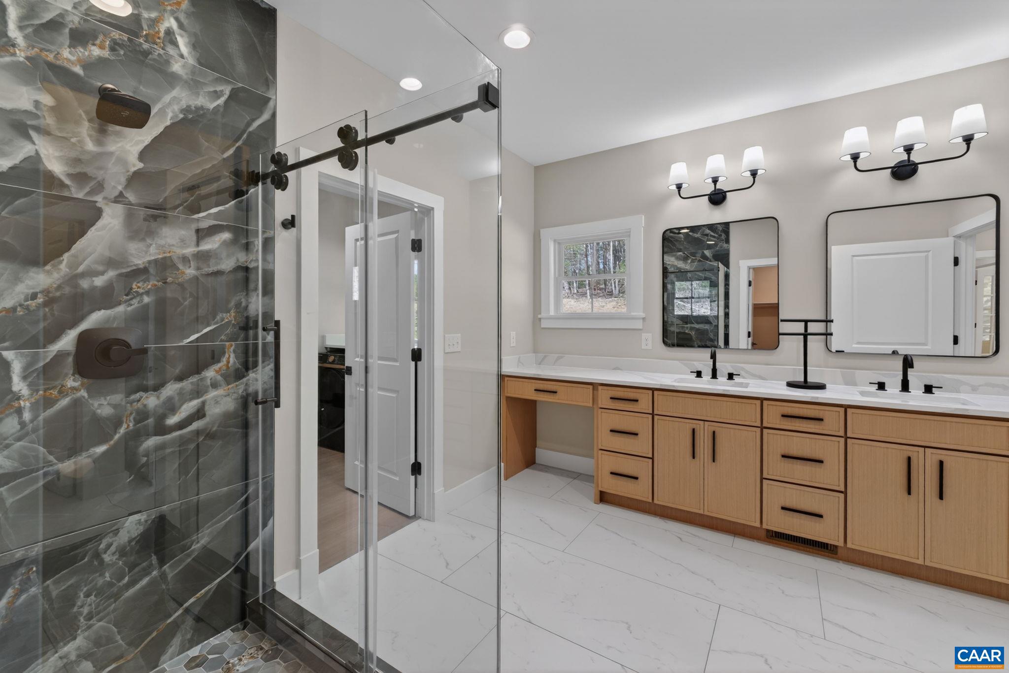 236 Palmer Place Ruckersville, VA 22968 - Photo 34 of 65 a spacious bathroom with a double vanity sink mirror and shower
