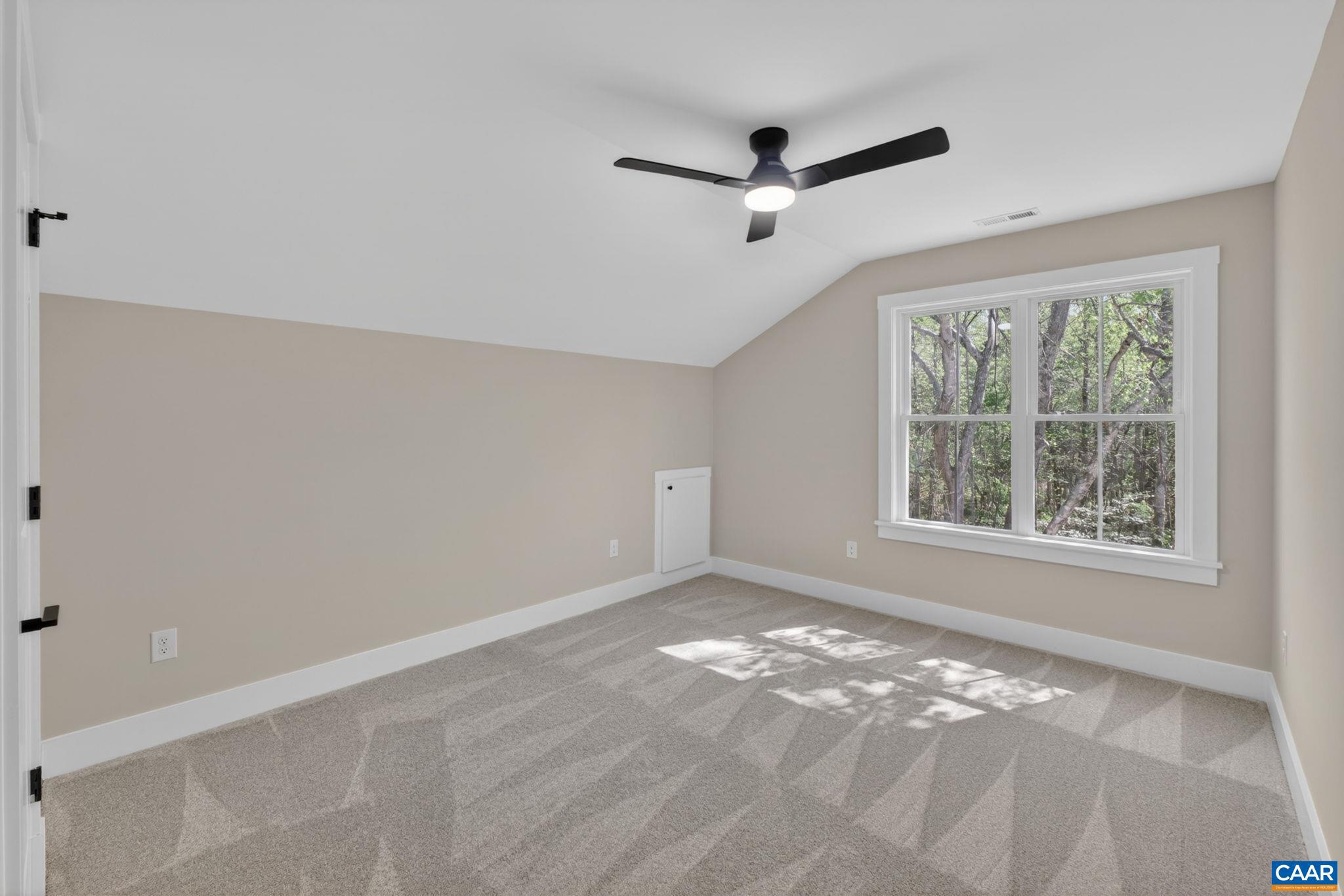 236 Palmer Place Ruckersville, VA 22968 - Photo 43 of 65 a view of a livingroom with a ceiling fan & windows
