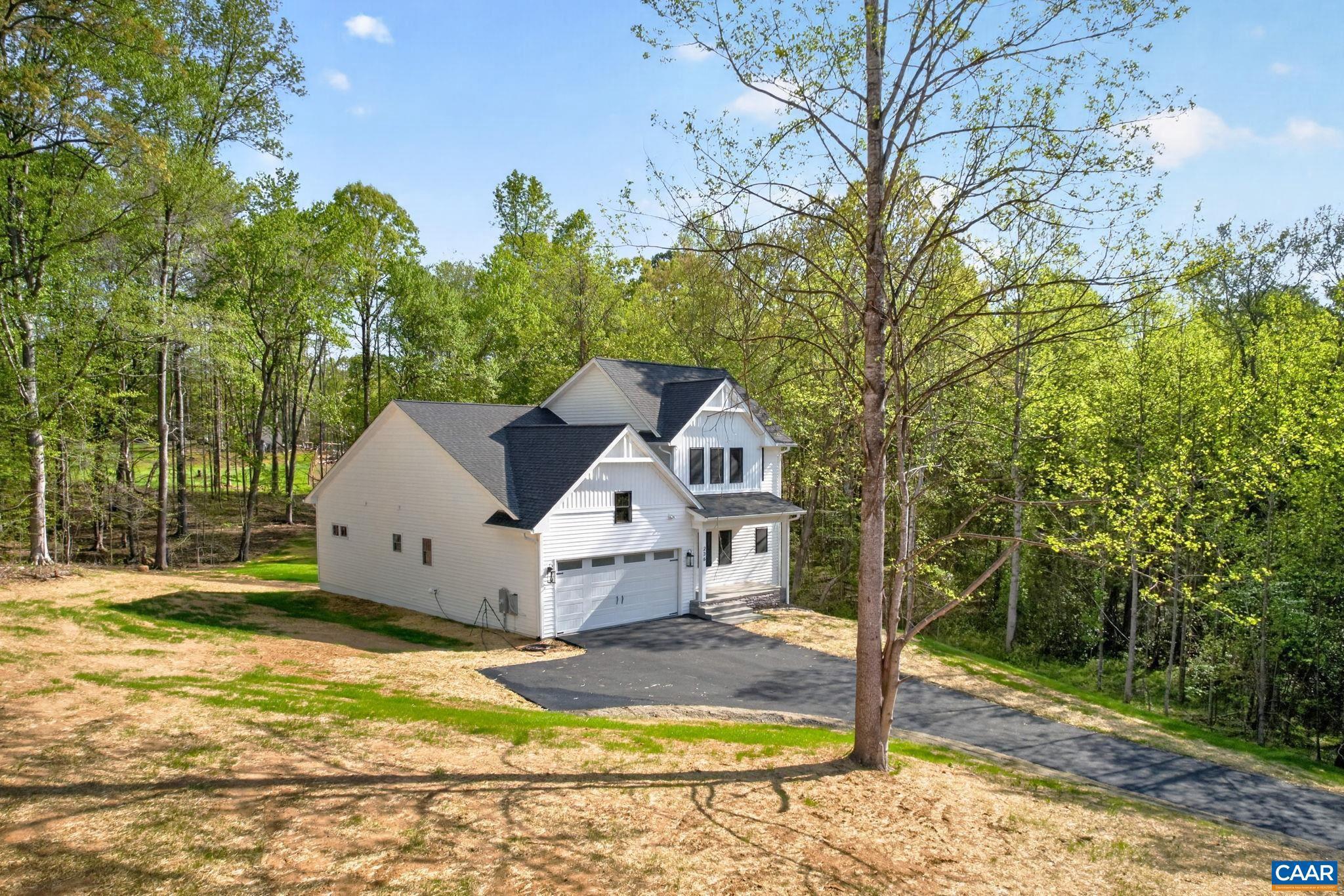 236 Palmer Place Ruckersville, VA 22968 - Photo 53 of 65 a front view of a house with a yard