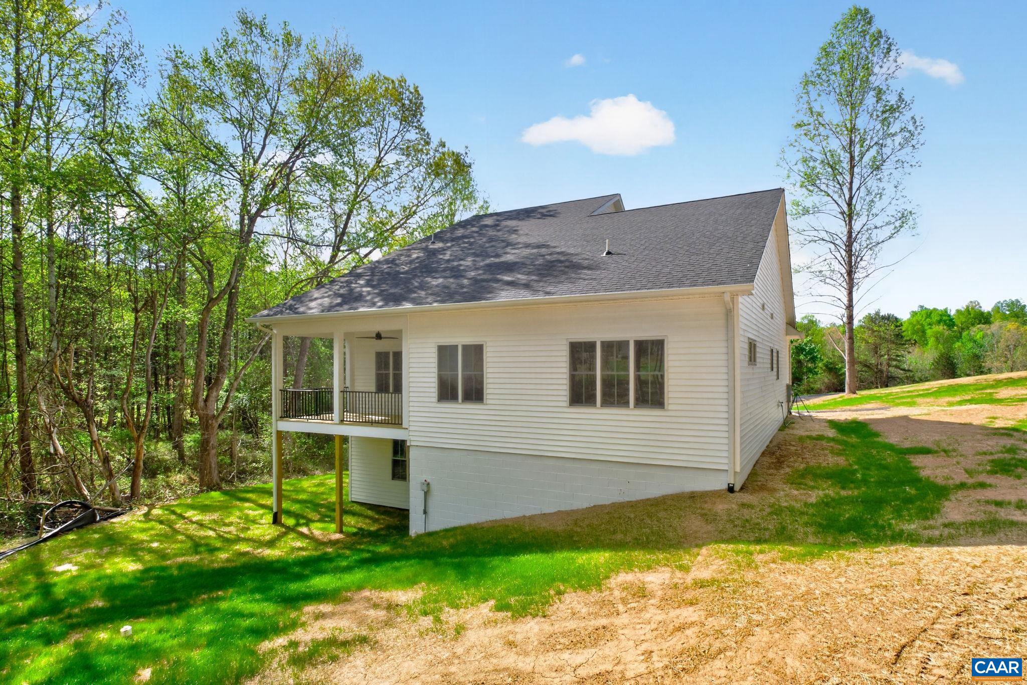 236 Palmer Place Ruckersville, VA 22968 - Photo 54 of 65 a view of a house with a yard