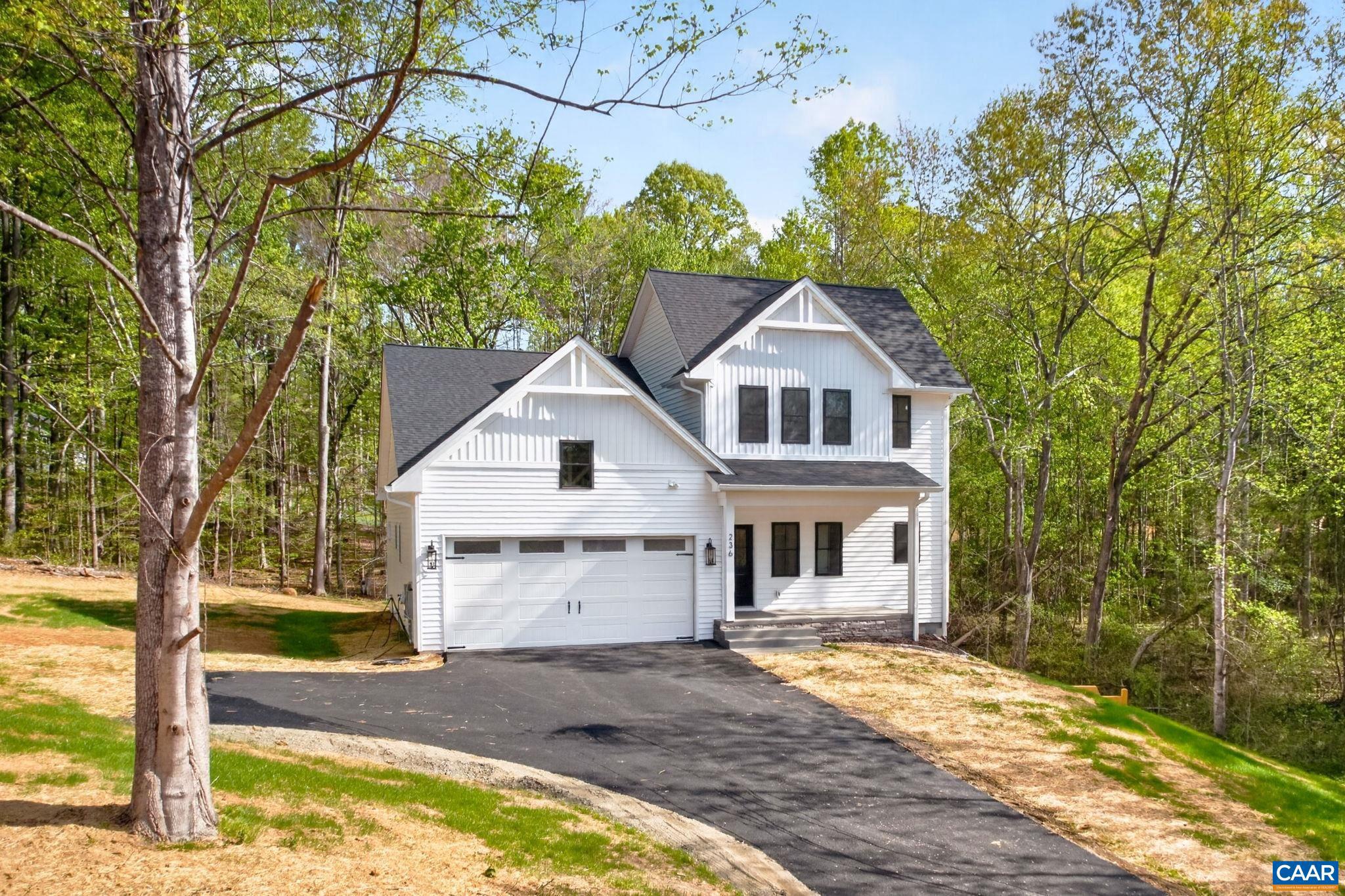 236 Palmer Place Ruckersville, VA 22968 - Photo 58 of 65 a front view of a house with a yard