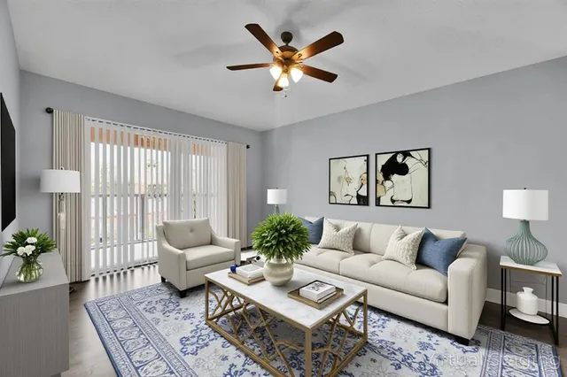 a living room with furniture and a large window