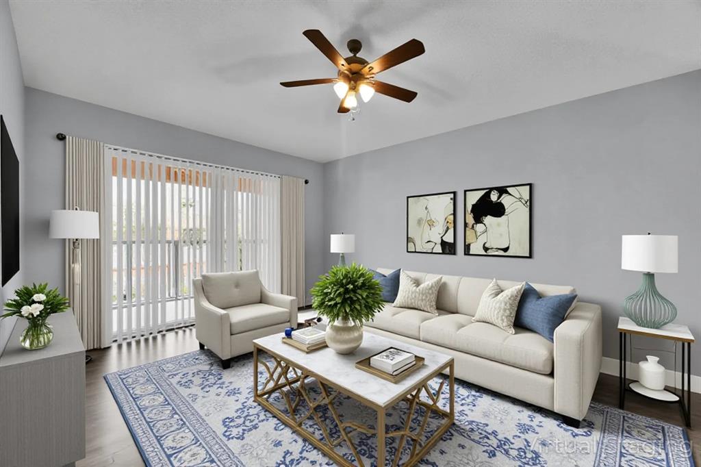 a living room with furniture and a large window