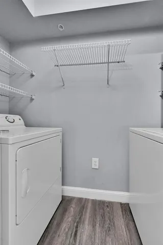 a view of storage and utility room with washer and dryer
