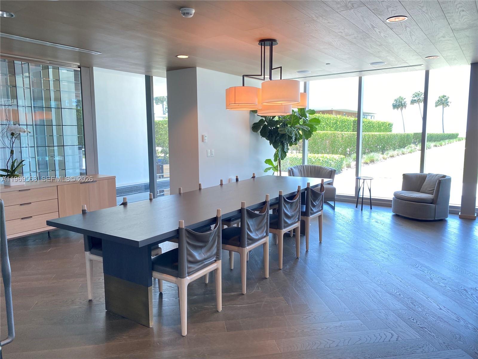 350 Ocean Drive, Unit 406N Key Biscayne, FL 33149 - Photo 37 of 41 a dining room with furniture window and wooden floor