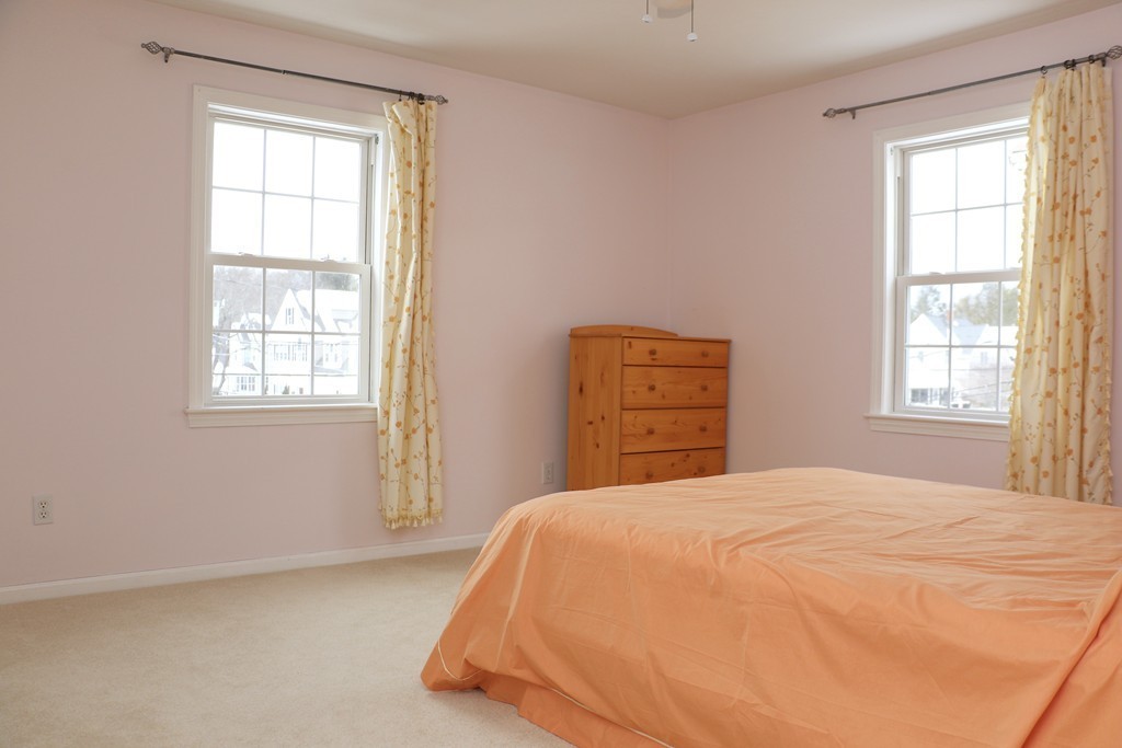 124 Maple Street, Unit 124 Needham, MA 02492 - Photo 12 of 16 a bedroom with a bed and a window