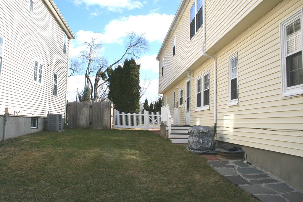 124 Maple Street, Unit 124 Needham, MA 02492 - Photo 14 of 16 a view of a house with a yard