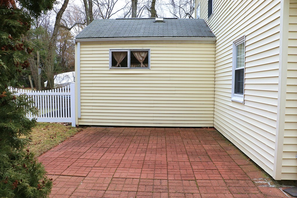 124 Maple Street, Unit 124 Needham, MA 02492 - Photo 15 of 16 a view of a house with a white door and wooden floor