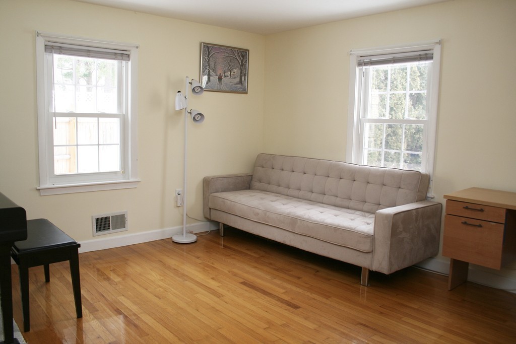 124 Maple Street, Unit 124 Needham, MA 02492 - Photo 9 of 16 a living room with furniture and a window