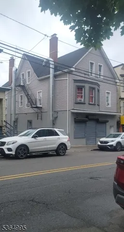 a front view of a house with parking space