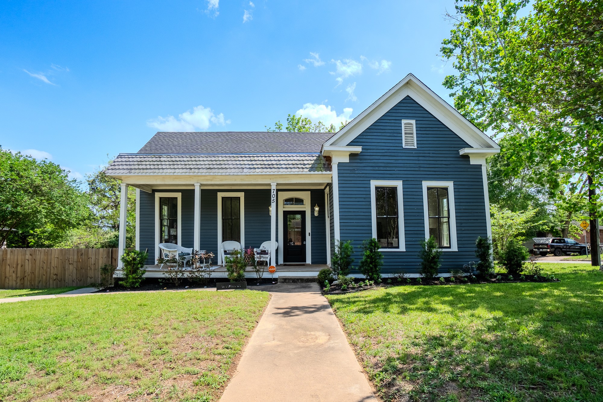 front view of a house with a yard