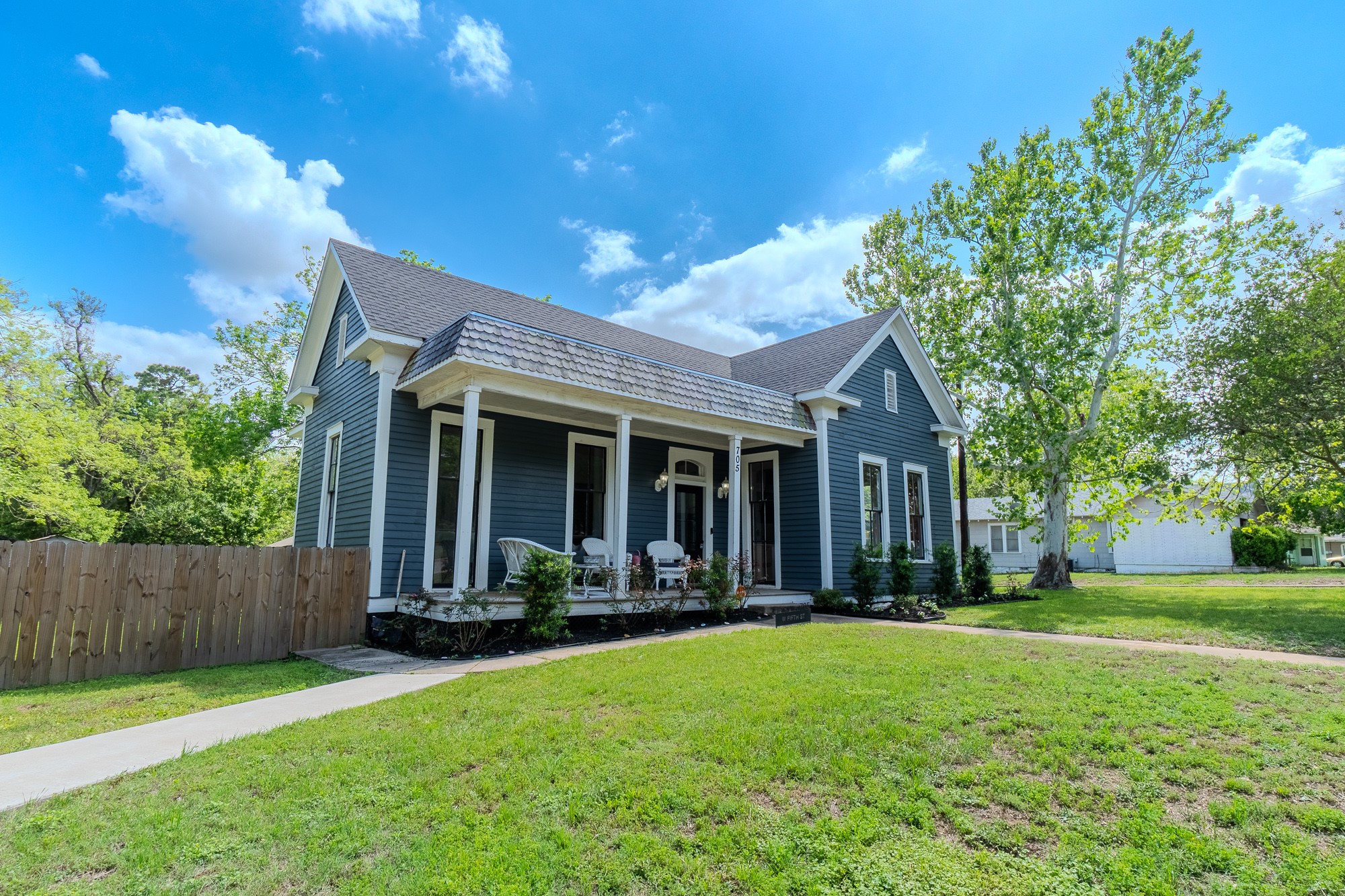 705 West 5th Street Brenham, TX 77833 - Photo 2 of 35 a view of a house with a yard