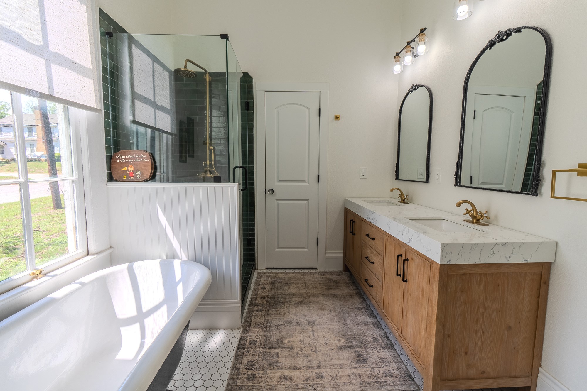 705 West 5th Street Brenham, TX 77833 - Photo 21 of 35 a bathroom with a double vanity sink mirror and bathtub