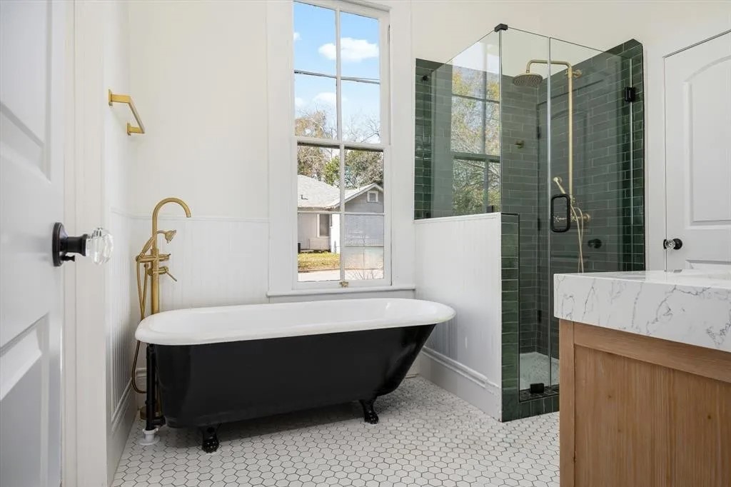 705 West 5th Street Brenham, TX 77833 - Photo 22 of 35 a bathroom with a tub sink and shower