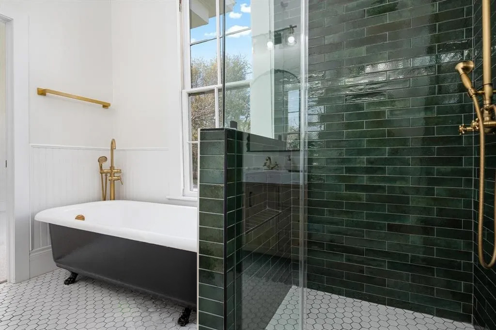 705 West 5th Street Brenham, TX 77833 - Photo 23 of 35 a bathroom with a bathtub and shower