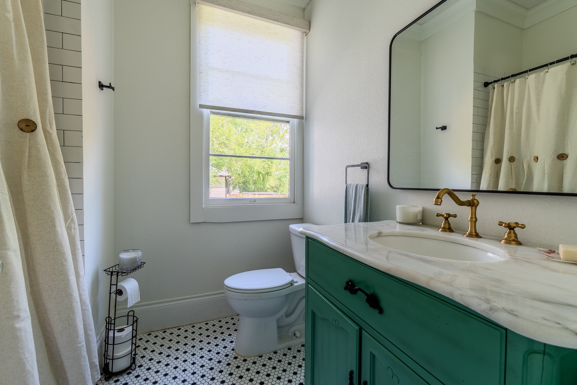 705 West 5th Street Brenham, TX 77833 - Photo 25 of 35 a bathroom with a granite countertop sink toilet and shower