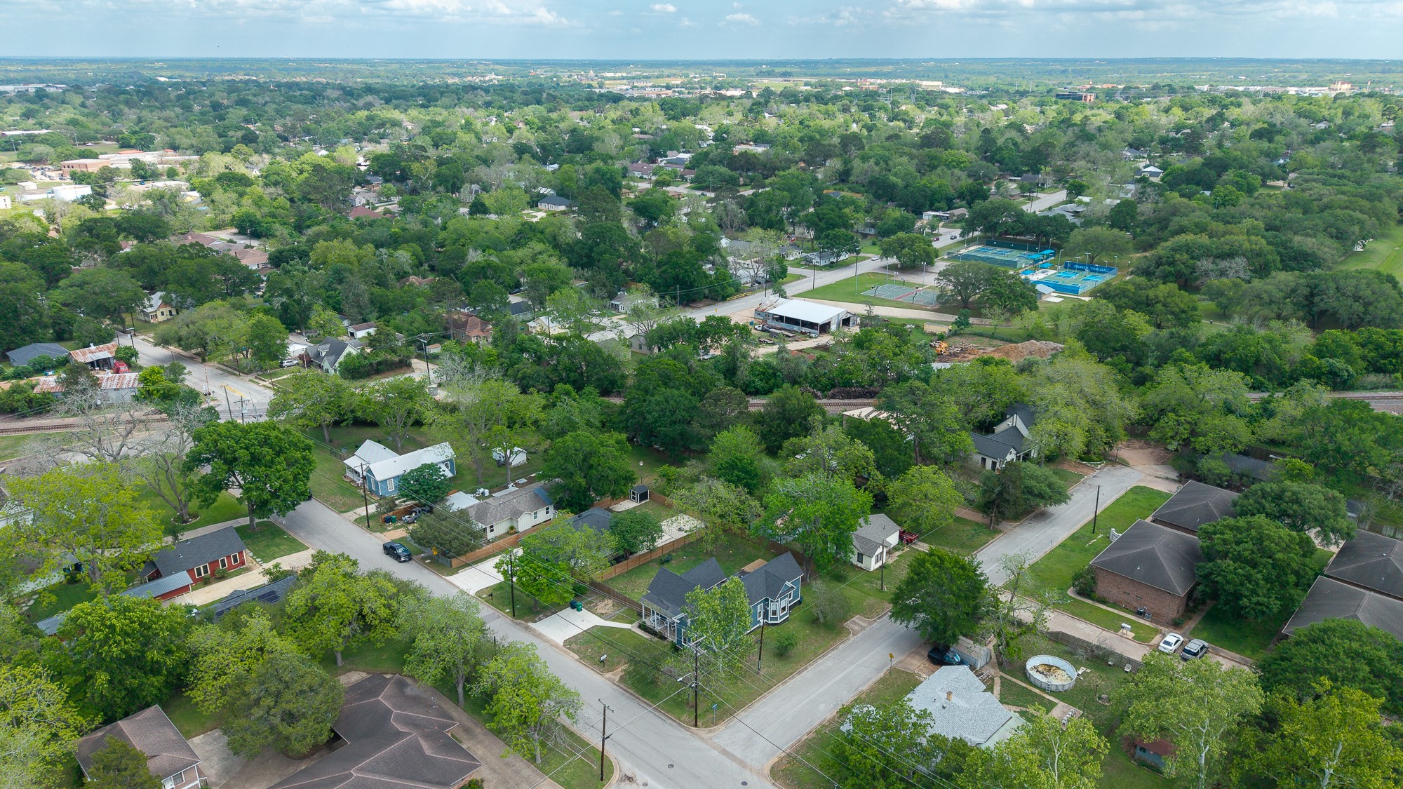 705 West 5th Street Brenham, TX 77833 - Photo 35 of 35 an aerial view of residential houses with outdoor space and trees