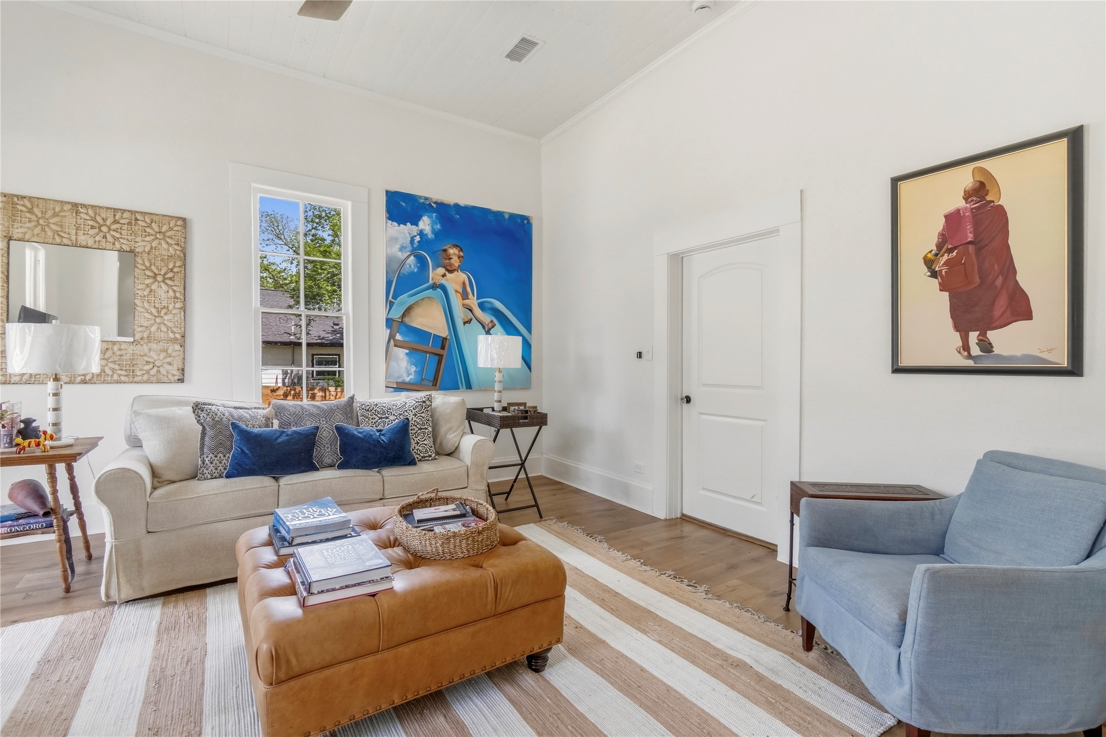705 West 5th Street Brenham, TX 77833 - Photo 7 of 35 a living room with furniture a couch and paintings on the wall