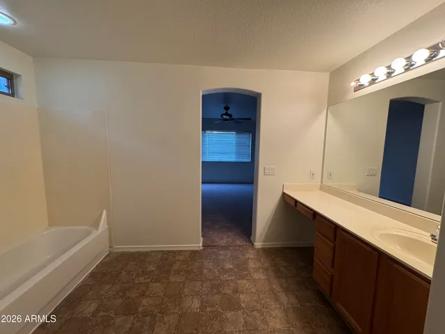 a bathroom with a bathtub and a sink