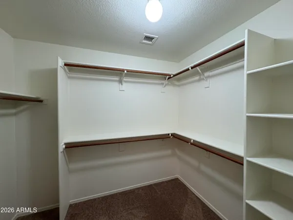 a view of an empty walk in closet