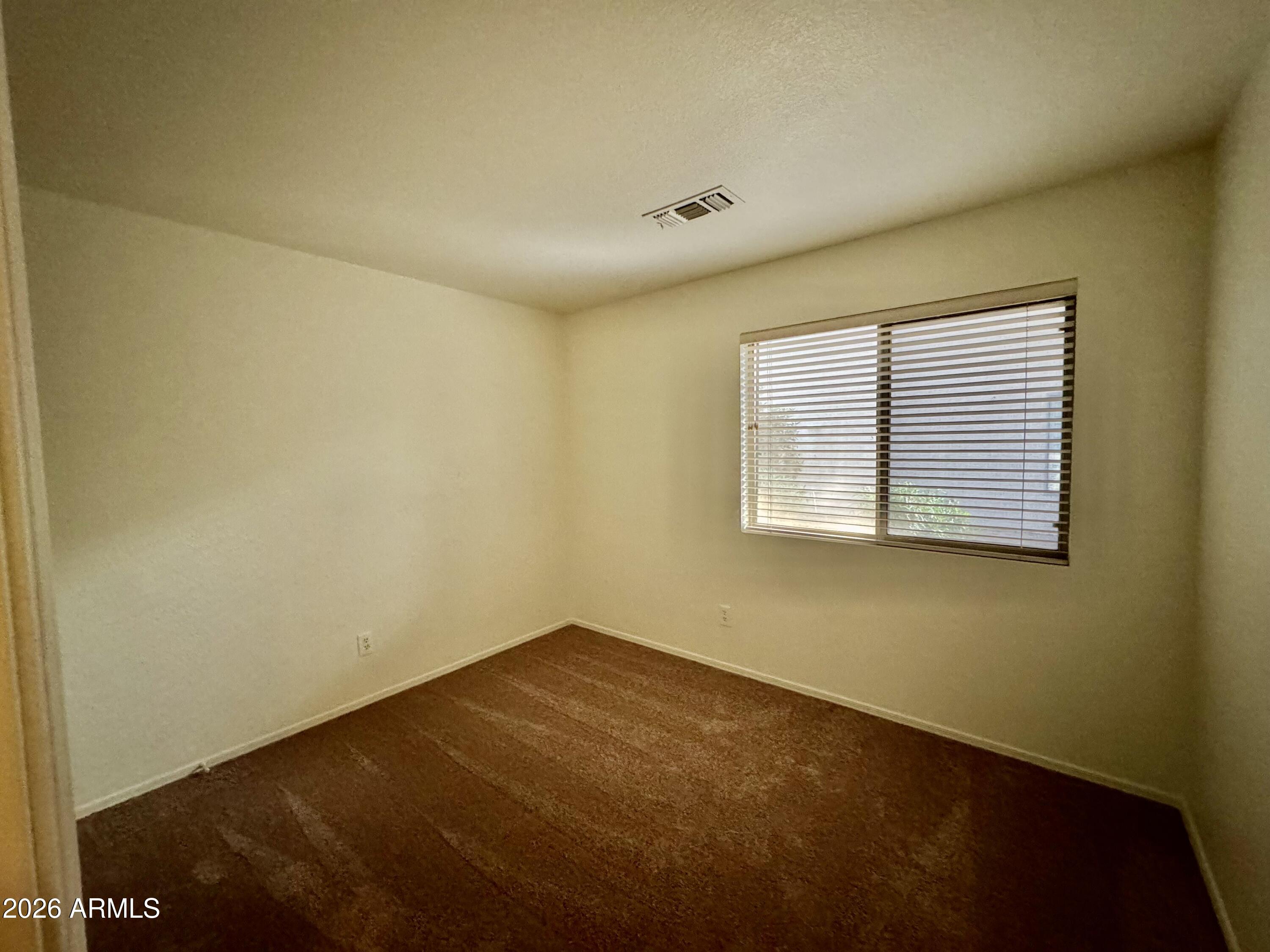 1126 East Shannon Street Gilbert, AZ 85295 - Photo 19 of 22 an empty room with a empty space and a window
