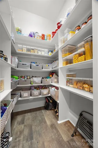 a kitchen with stainless steel appliances granite countertop a sink and a stove