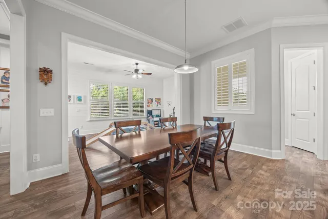 a dining room with furniture and window