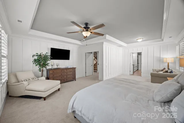 a bedroom with a bed couch and window