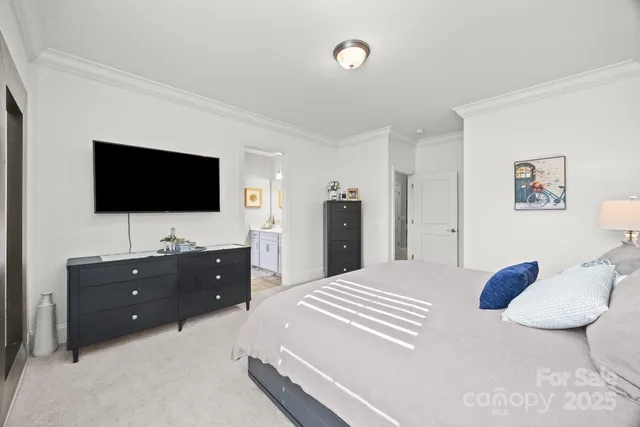 a bathroom with a sink a large mirror and a light fixture
