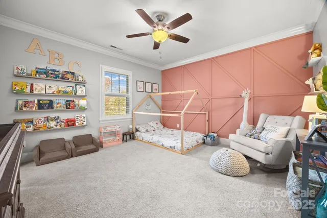 a bed room with a bed and a baby