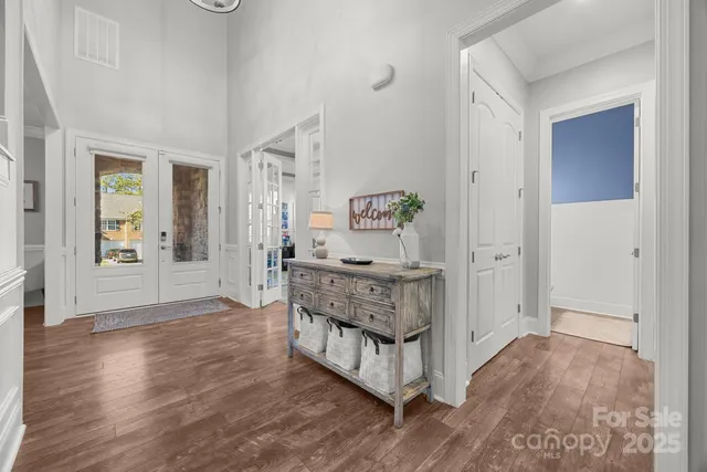 a view of an entryway with wooden floor