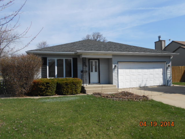 90 Long Beach Road Montgomery, IL 60538 - Photo 1 of 13 a front view of a house with a garden and yard