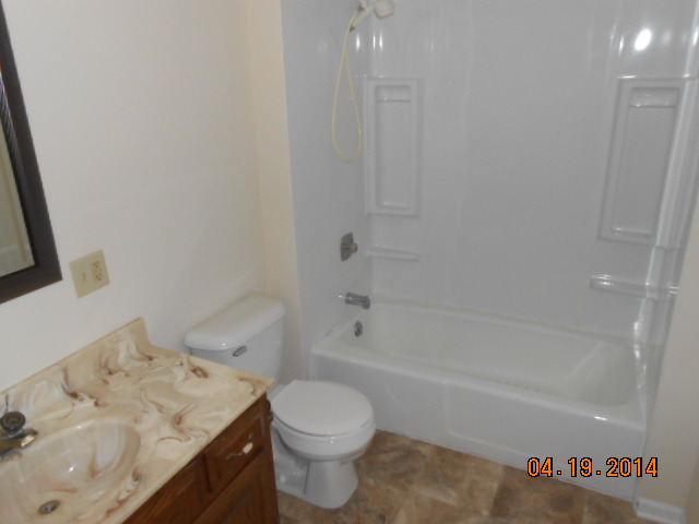 90 Long Beach Road Montgomery, IL 60538 - Photo 8 of 13 a bathroom with a sink a toilet and shower