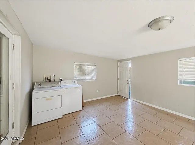 a view of a kitchen with a sink dishwasher and a fireplace