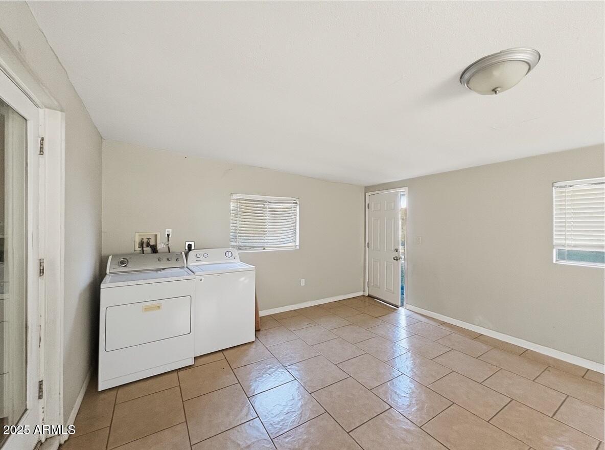 1366 West 15th Street Tempe, AZ 85281 - Photo 11 of 14 a view of a kitchen with a sink dishwasher and a fireplace