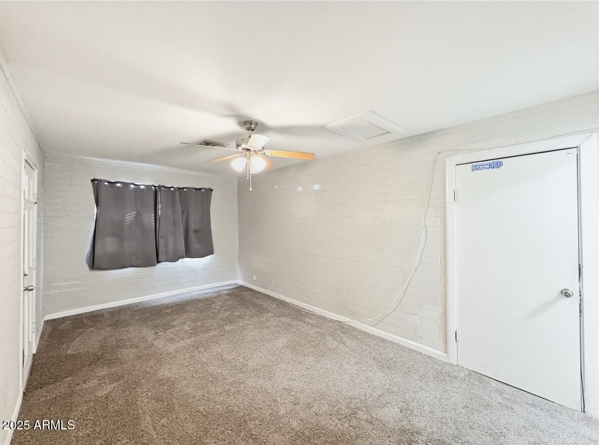 1366 West 15th Street Tempe, AZ 85281 - Photo 10 of 14 an empty room with a fan & a bathroom