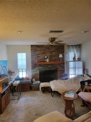 a view of a kitchen with white cabinets