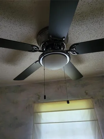 a bedroom with furniture and a chandelier