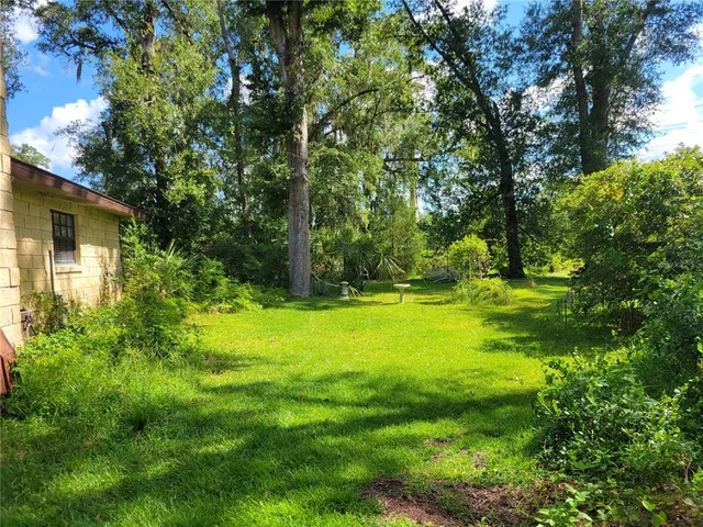 a view of outdoor space with deck and green space