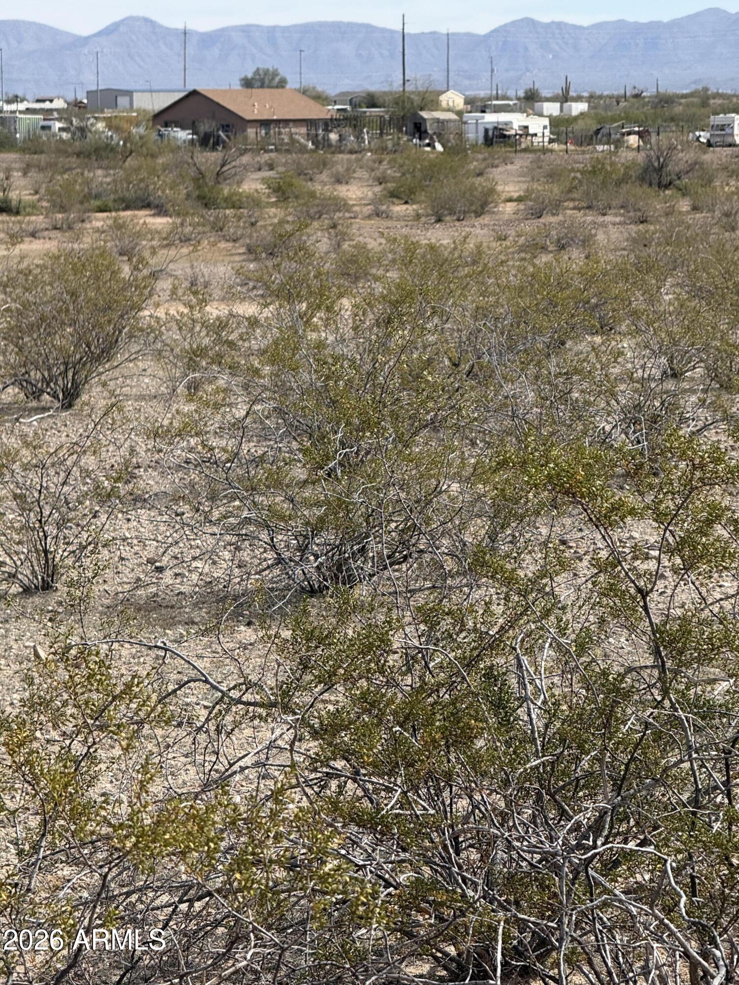 29999 West Peak View Road, Unit 15 Wittmann, AZ 85361 - Photo 15 of 20 an aerial view of residential houses with outdoor space and trees