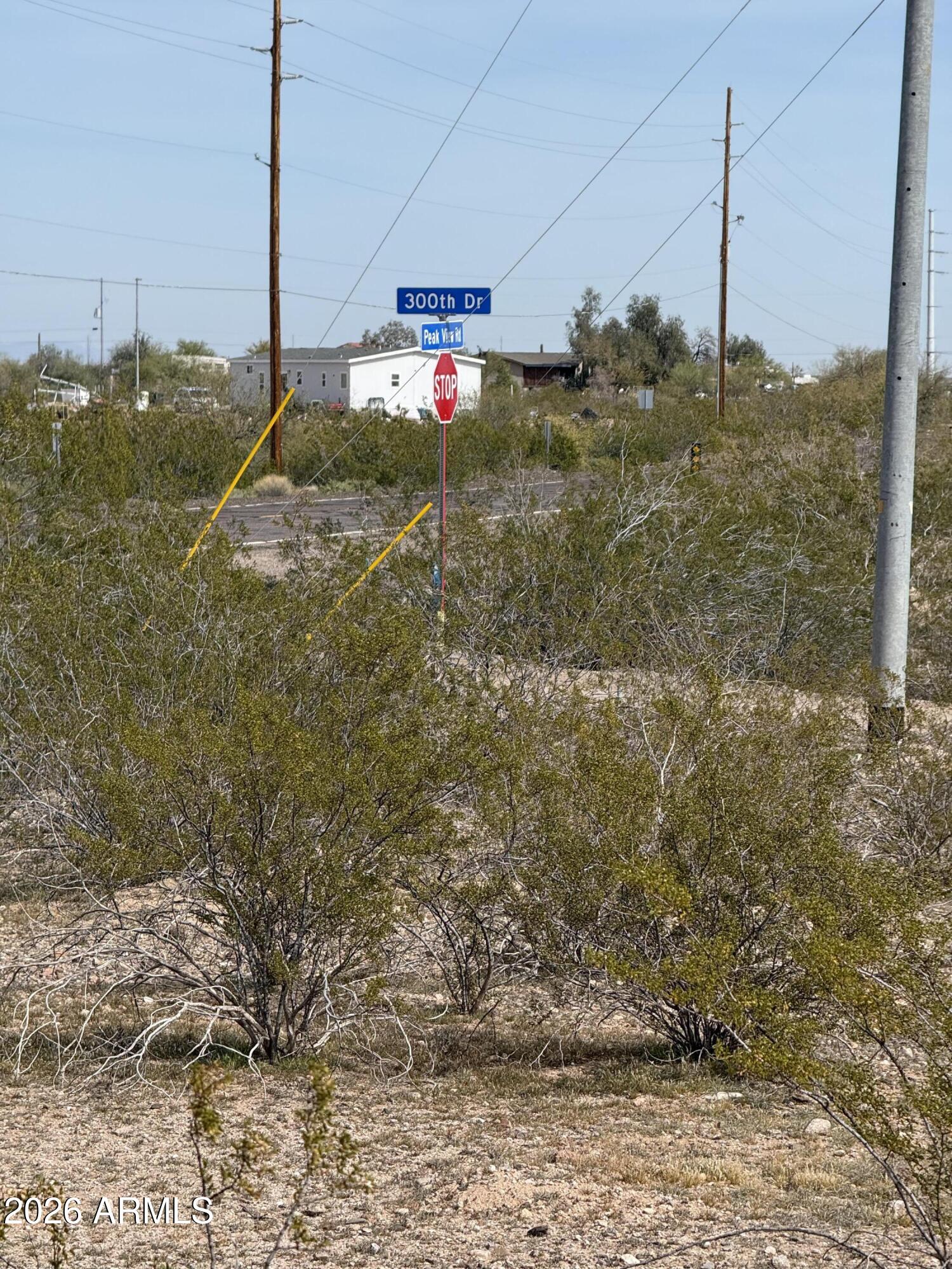 29999 West Peak View Road, Unit 15 Wittmann, AZ 85361 - Photo 17 of 20 a view of a road with an outdoor space