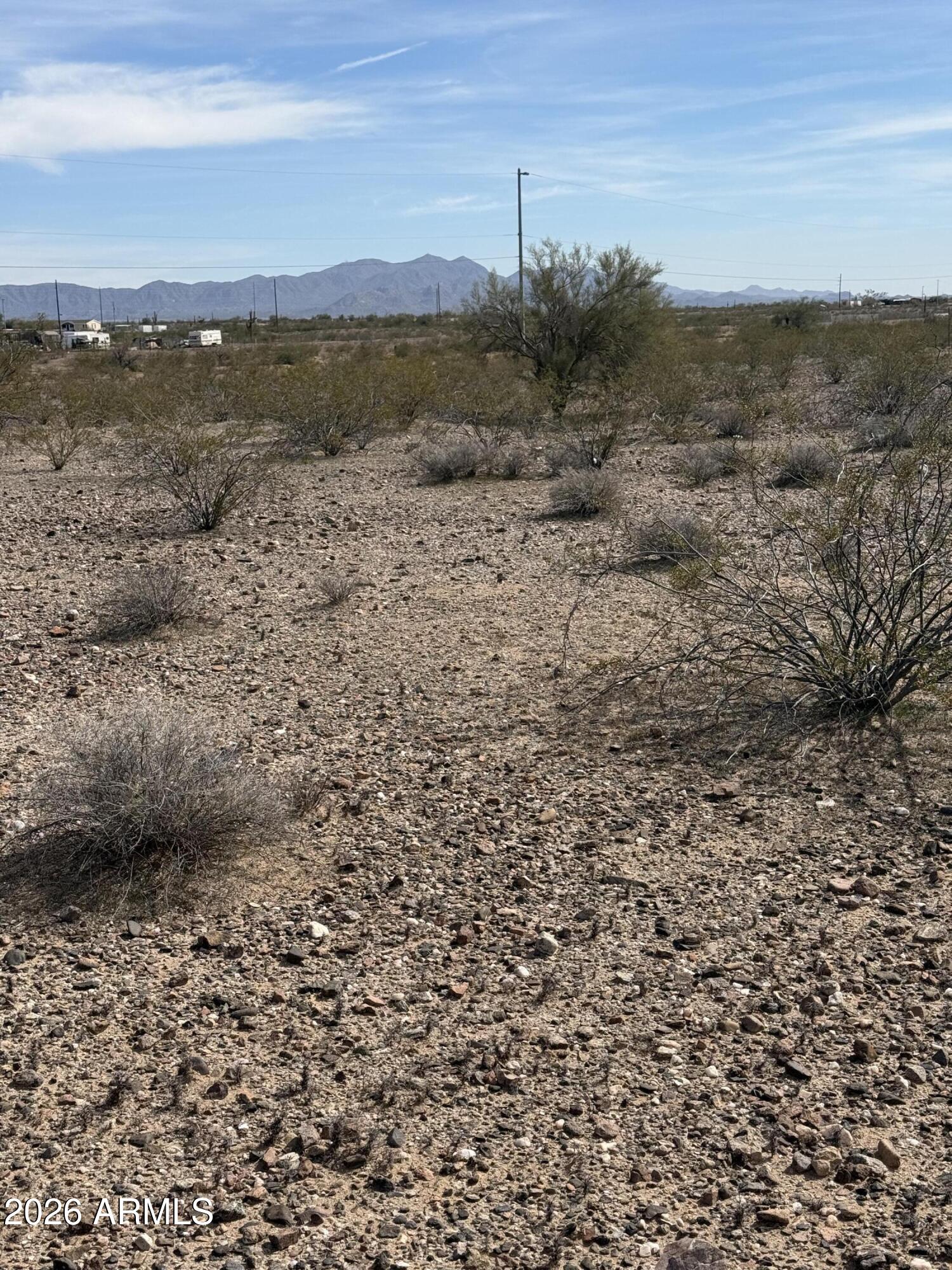 29999 West Peak View Road, Unit 15 Wittmann, AZ 85361 - Photo 5 of 20 a view of a lake with a mountain