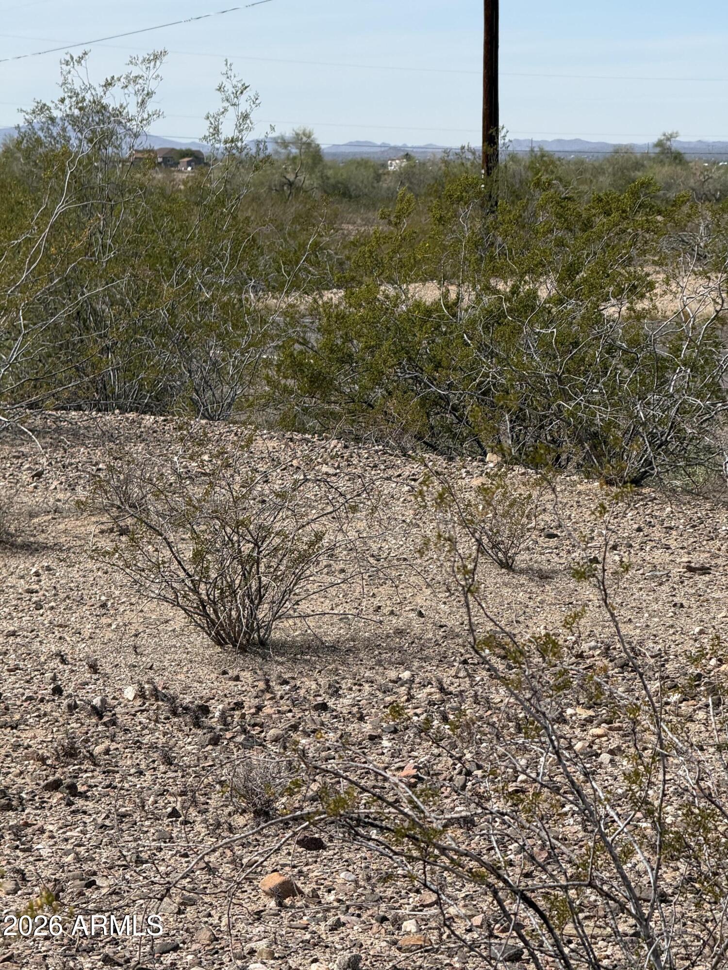 29999 West Peak View Road, Unit 15 Wittmann, AZ 85361 - Photo 7 of 20 a view of a yard with an ocean view