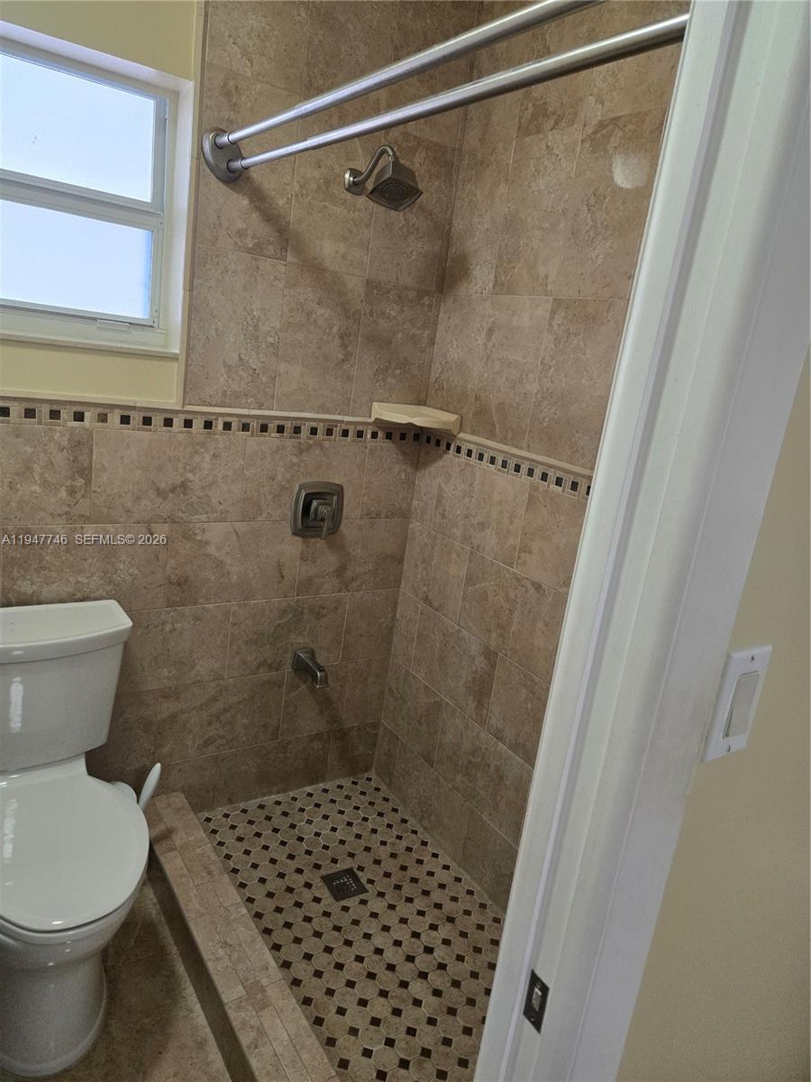 2749 West 73rd Place Hialeah, FL 33016 - Photo 11 of 15 a bathroom with a toilet and a shower